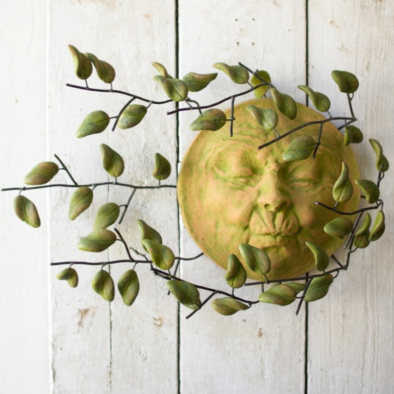 Sun Face With Blowing Leaves Wall Art